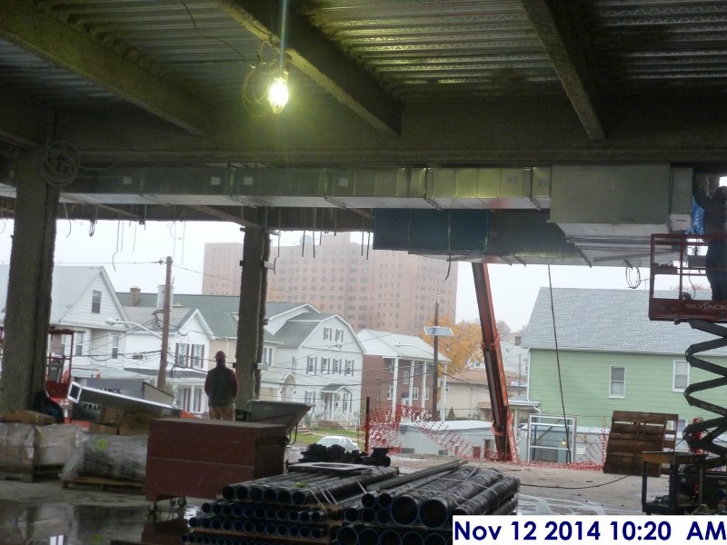 Installing duct work at the 2nd floor Facing North